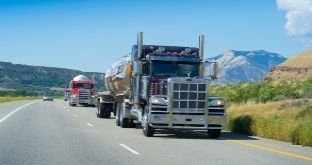 Trucks driving on scenic road