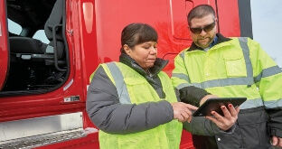Truck drivers reviewing policies and procedures