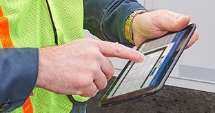 Truck driver using compliance tablet