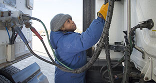 Driver doing pre-trip inspection