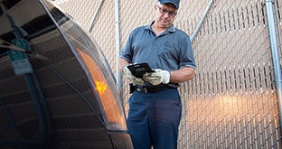 Driver inspecting straight truck