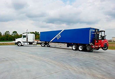 Metal Sales Semi trailer with three wheel lift in parking area