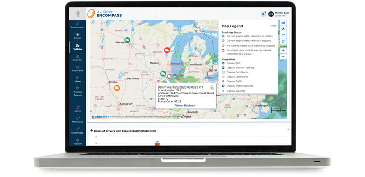 Laptop with vehicle tracking information on screen