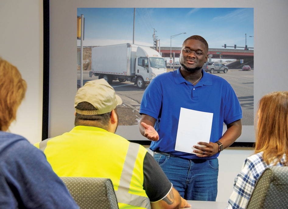 Truck drivers receiving training from J. J. Keller