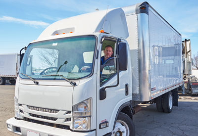 White box truck with driver