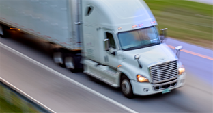 white cab and trailer on highway 312x165