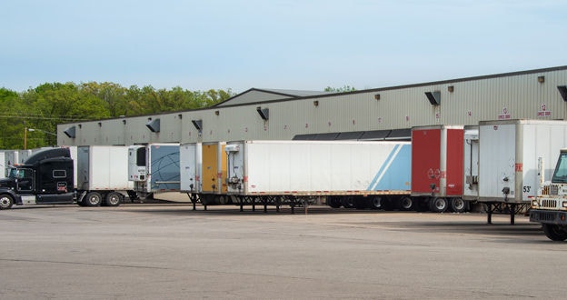 Various branded trailers lined up at loading docks