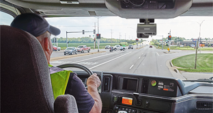 Dual-facing dash cam on windshield