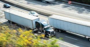 Semi trucks driving on highway