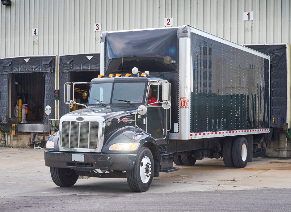 box truck backed up to loading dock