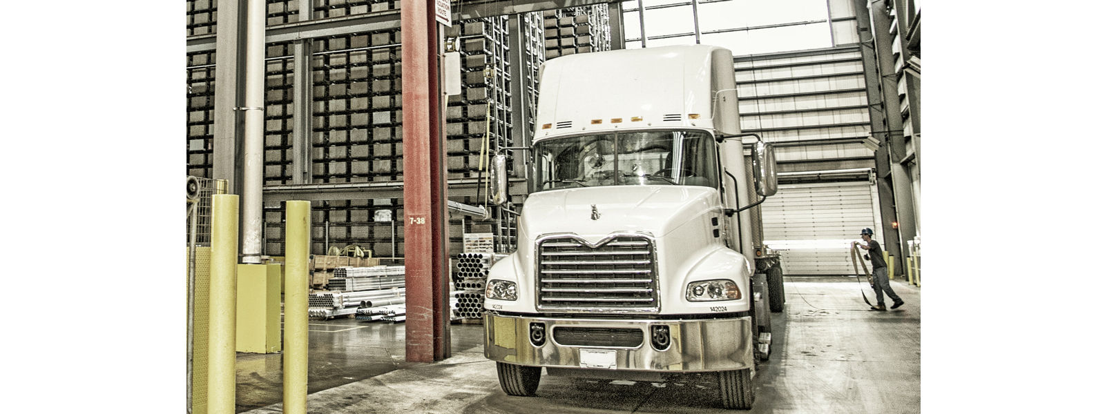 Tracker flatbed inside warehouse loading area