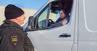 Driver talking with officer