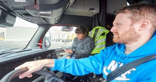 Truck driver team in cab