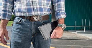 Driver holding compliance tablet