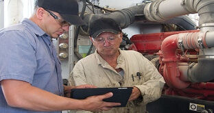 Fleet technicians doing maintenance inspection