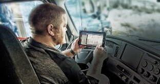 Truck driver using electronic logging tablet