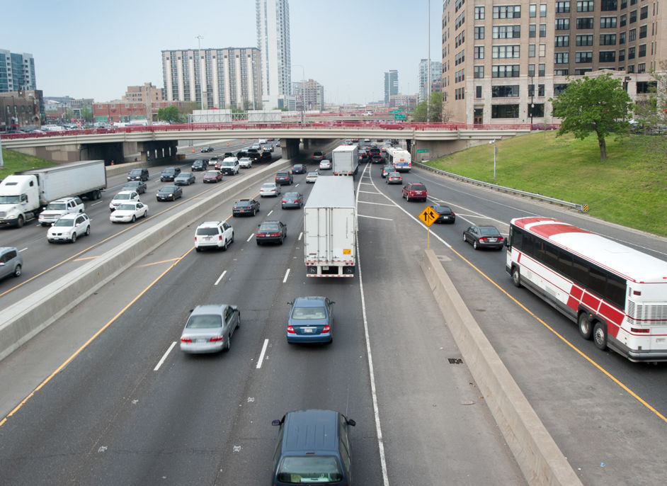 Eight lanes of busy traffic going through city