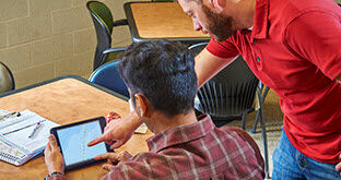 Drivers looking at ELog tablet